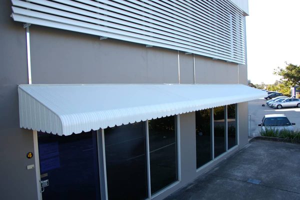 Aluminium Window Hood with fully enclosed side panel installed outside a shop in Brisbane